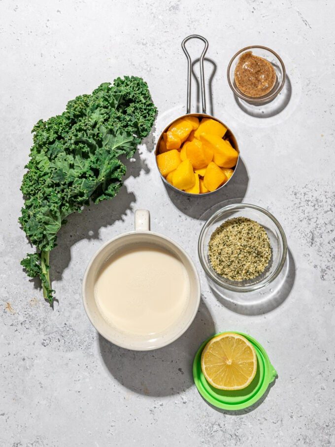 kale, mango, soy milk and hemp hearts in bowls