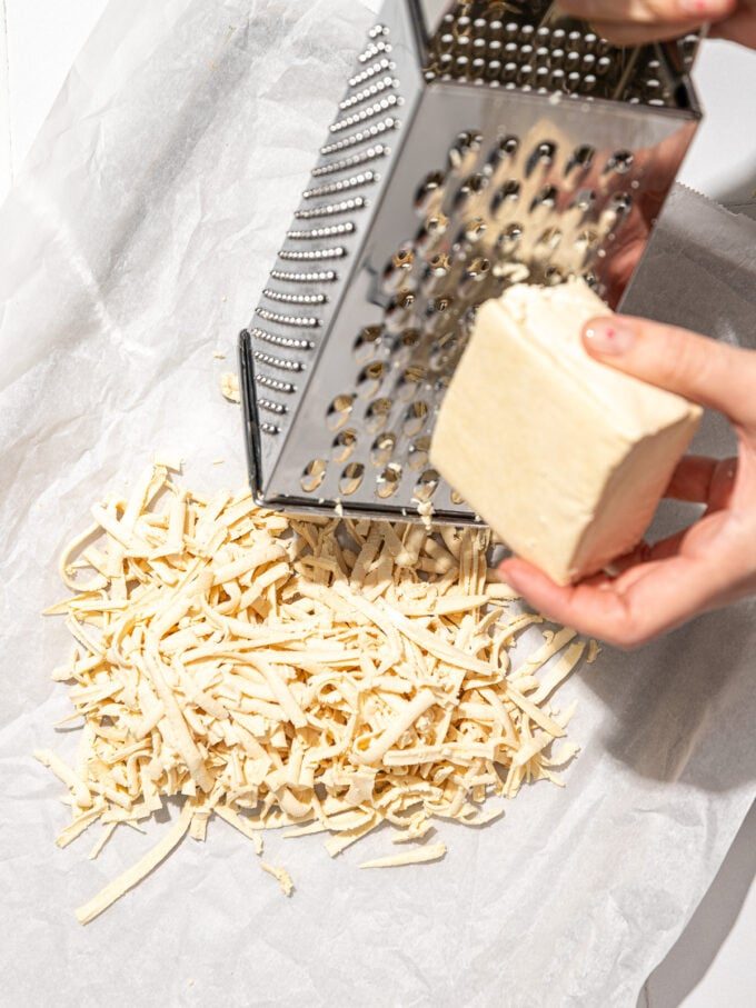 hand grating tofu