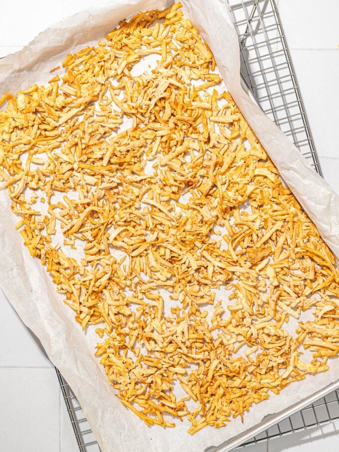 Grated and baked tofu on baking sheet