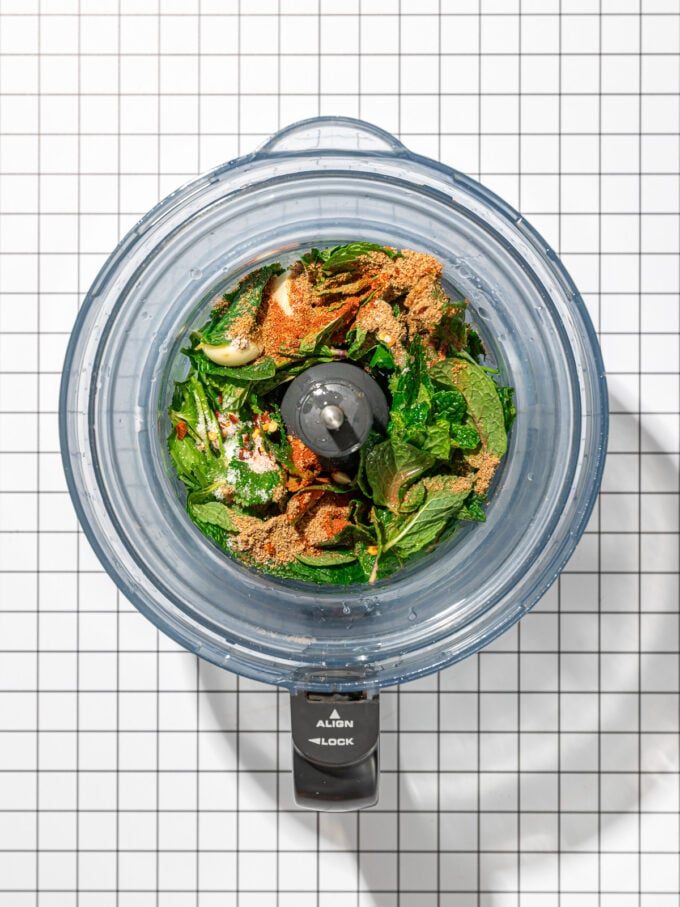 cilantro and spices in a food processor