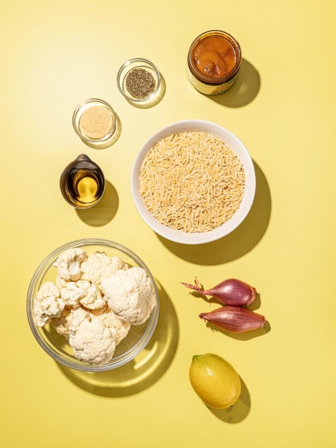 cauliflower, orzo, lemon in bowls