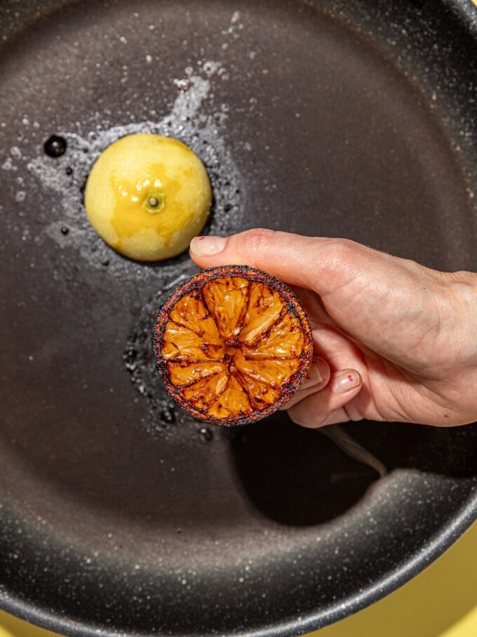 hand holding charred lemon