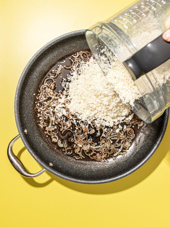 pouring cauliflower rice into skillet