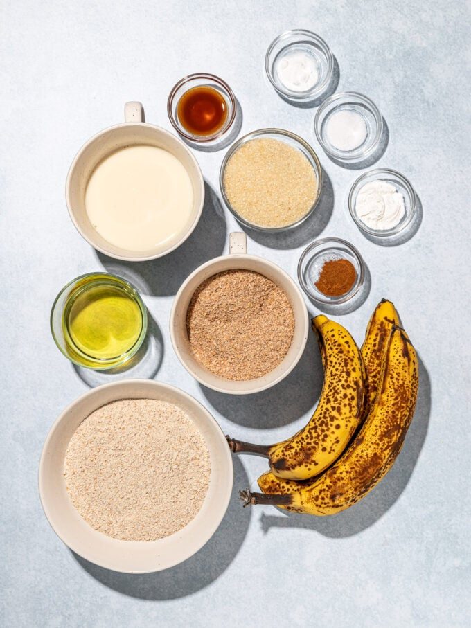 ripe bananas, whole wheat flour, wheat bran in white bowls