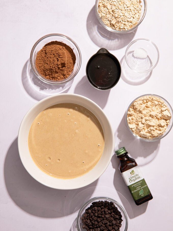 tahini, oats, protein powder and cocoa in bowls