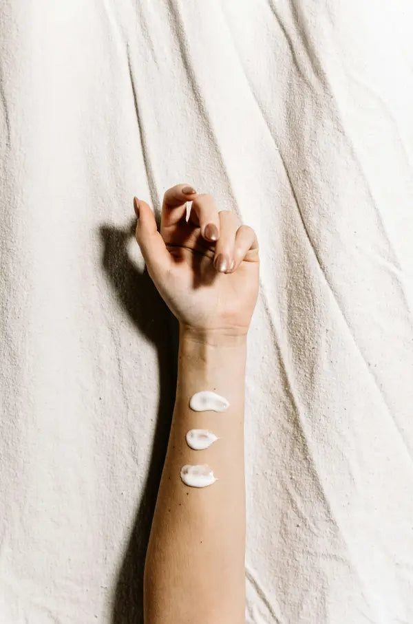 cream on arm
